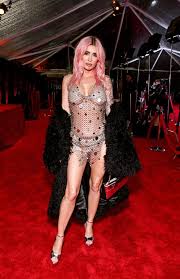 Megan Fox Turns Heads in Revealing Chainmail Dress and Debuts Pink Hair at 2024 Grammys Party