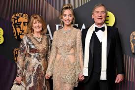 Emily Blunt Stuns at 2024 BAFTA Film Awards with Parents by Her Side