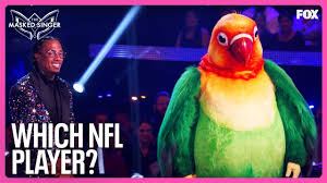 Travis Kelce Could be The Masked Singer’s Lovebird, According to Ken Jeong (Exclusive)