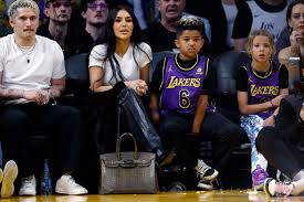 Kim Kardashian Shocks Fans by Placing Birkin Bag on the Floor at NBA Game