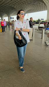 Karisma Kapoor Spotted with Black Leather Shoulder Bag Worth ₹3.75 Lakh at Mumbai Airport