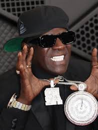 Exclusive: Flavor Flav Stuns Mario Andretti with Autograph Request at Indy 500