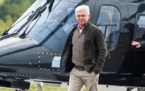 Phillip Schofield Makes Grand Entrance at Silverstone by Helicopter