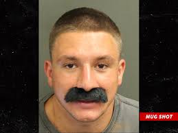 YouTube Star SteveWillDoIt Arrested at Universal Orlando Resort: Epic Mustache Mug Shot